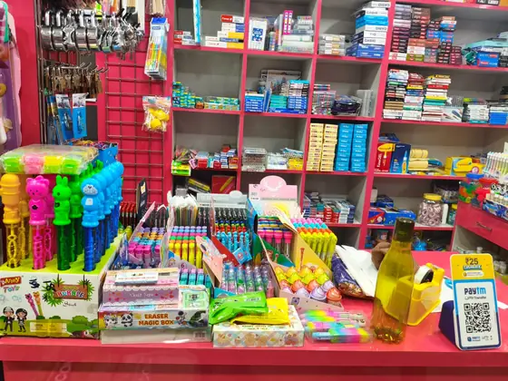 The billing counter at Bajrang Stationary, with UPI accepted