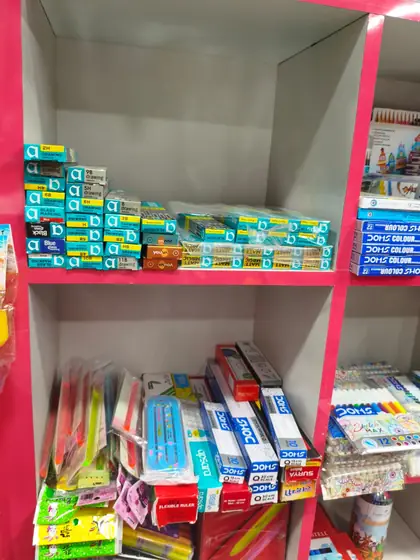 Shelf of colouring sets, sketch pens and oil pastels