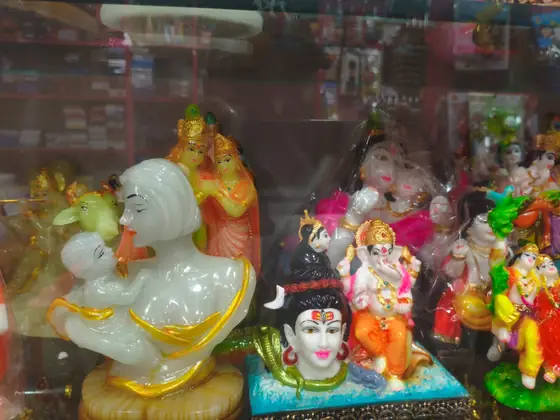 Showcase shelf of god idols and decorative statues