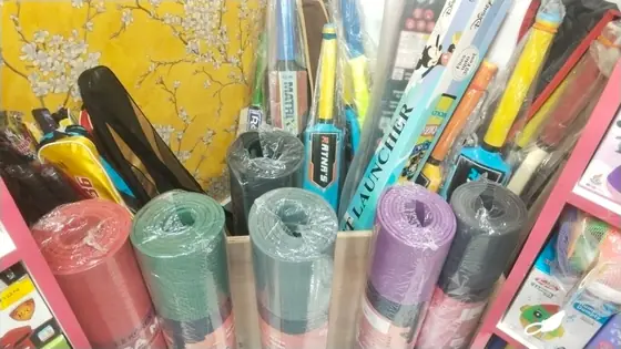 Markers, highlighters, stapler and rolled chart paper