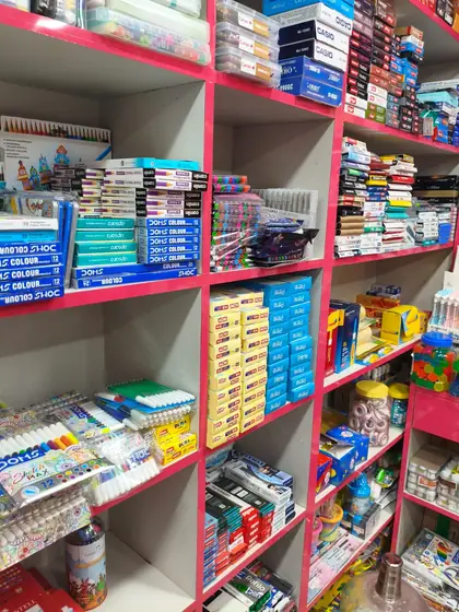 Racks of ball pens, gel pens and colour boxes