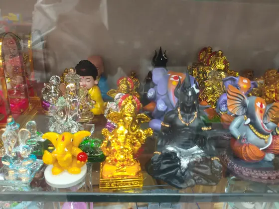 Silver-finish idols and small pooja gift items